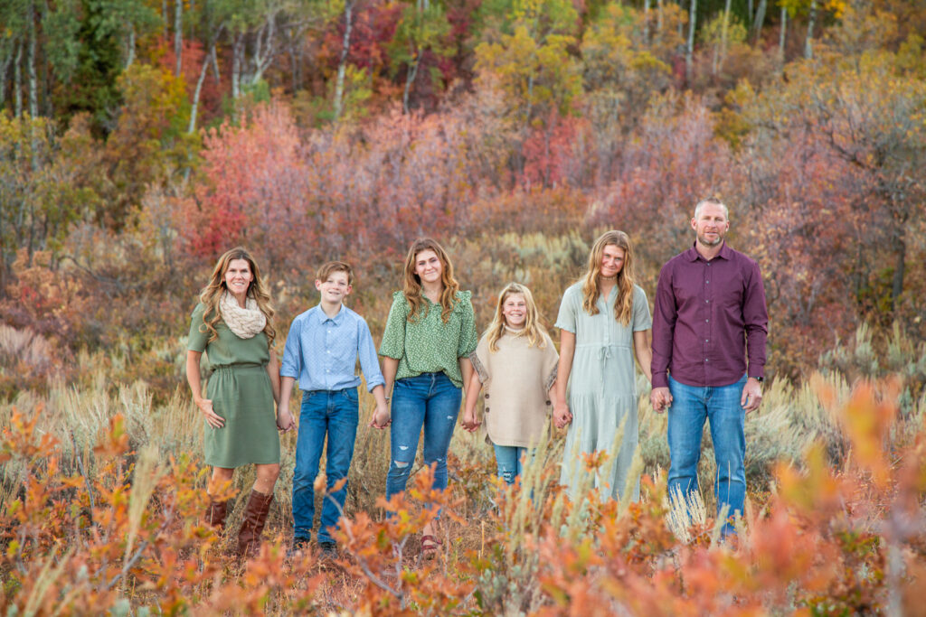 Fall family photo in fall leaves