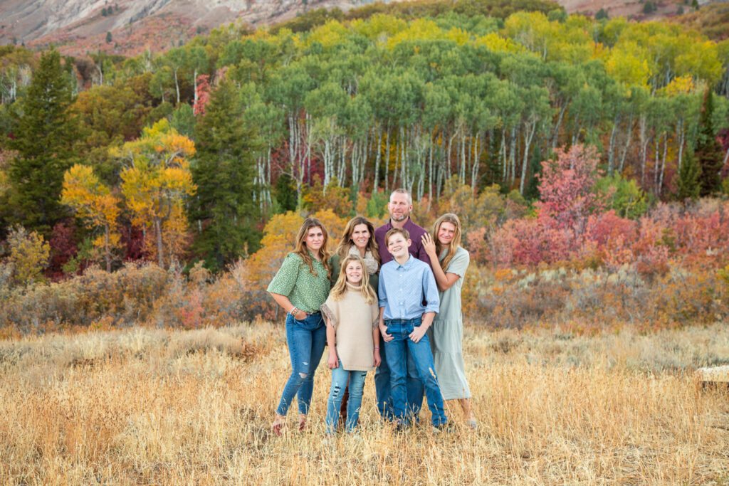 Fall family photo with scenic landscape 